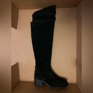 Black boots, knee high, small heel.